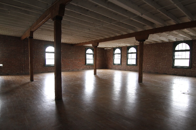 1900s Building with Brick Exterior and Multiple Interior Settings: Three Story Old Building constructed in 1908, perfect for a period piece or a contemporary setting depictung urban America. Has multiple locations in a single building (Garage, Elevator, Old Staircase, Several Studios, Industrial Rooftop). Brick exterior. Can be used for scenes ranging from an apartment, loft or industrial warehouse to an early 20th century sidewalk or city block. Rate stated is for a 12 hour FILM day only. Prep and Strike days are $2500 each. PHOTOGRAPHY allowed at $2500 for a 10 hour day. Smaller productions - for less hours - can be negotiable.